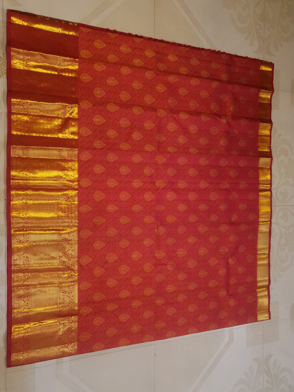 Chilly Red Kanchipuram handloom 2G gold pattu silk saree featuring traditional gold zari weaving and rich elephant and floral motifs.