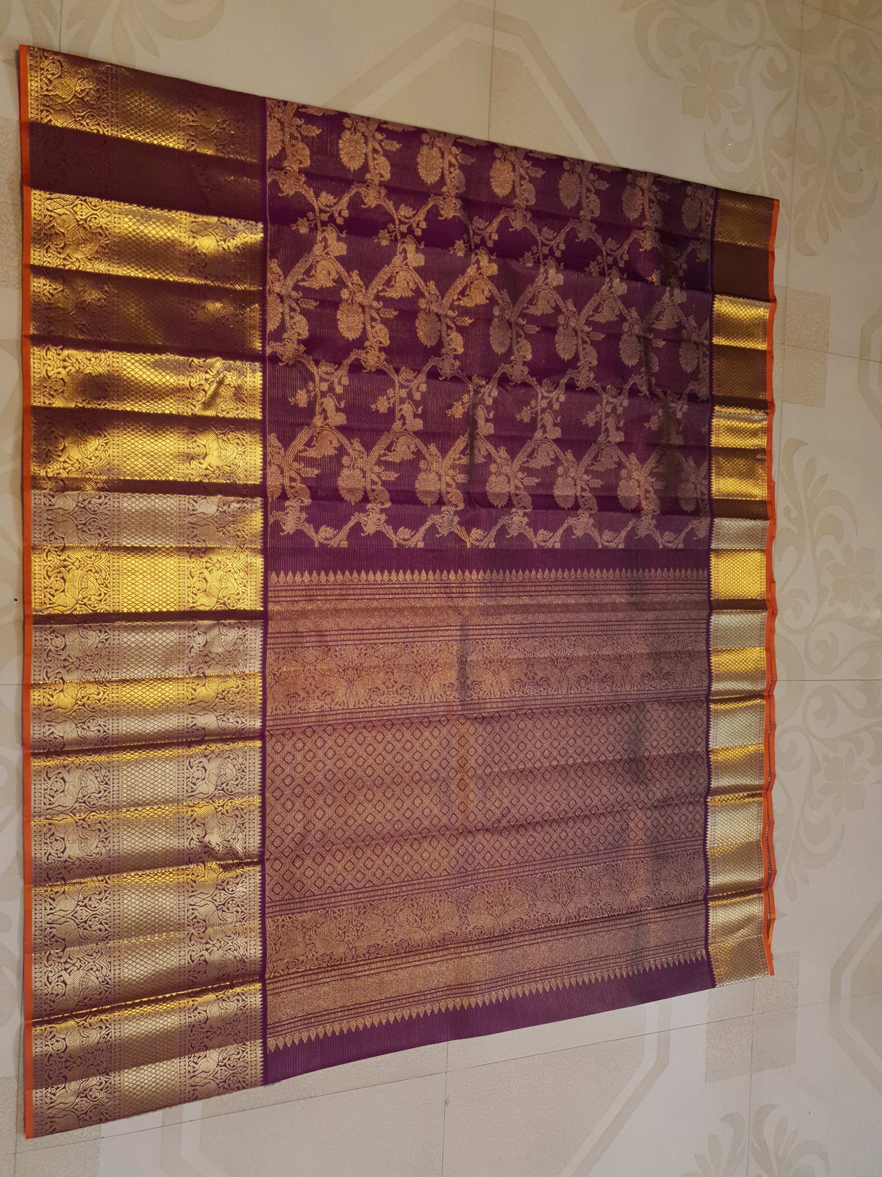 Magenta Kanchipuram handloom silk saree featuring 2G gold vairaoosi stripes, traditional floral motifs, a rich zari border, and Silk Mark certification.