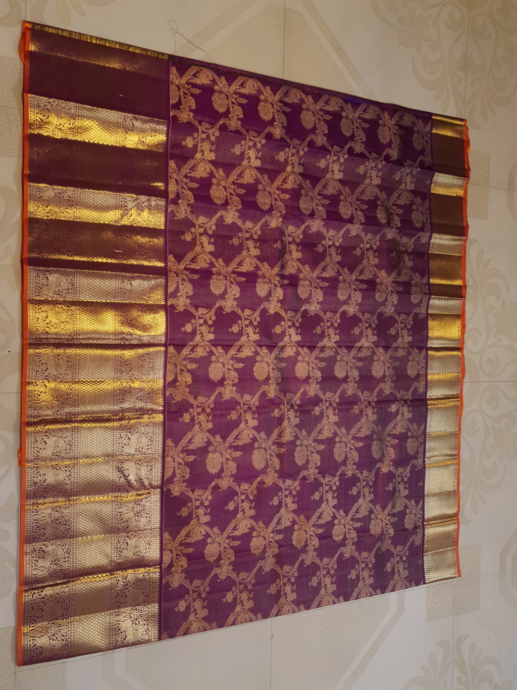 Magenta Kanchipuram handloom silk saree featuring 2G gold vairaoosi stripes, traditional floral motifs, a rich zari border, and Silk Mark certification.