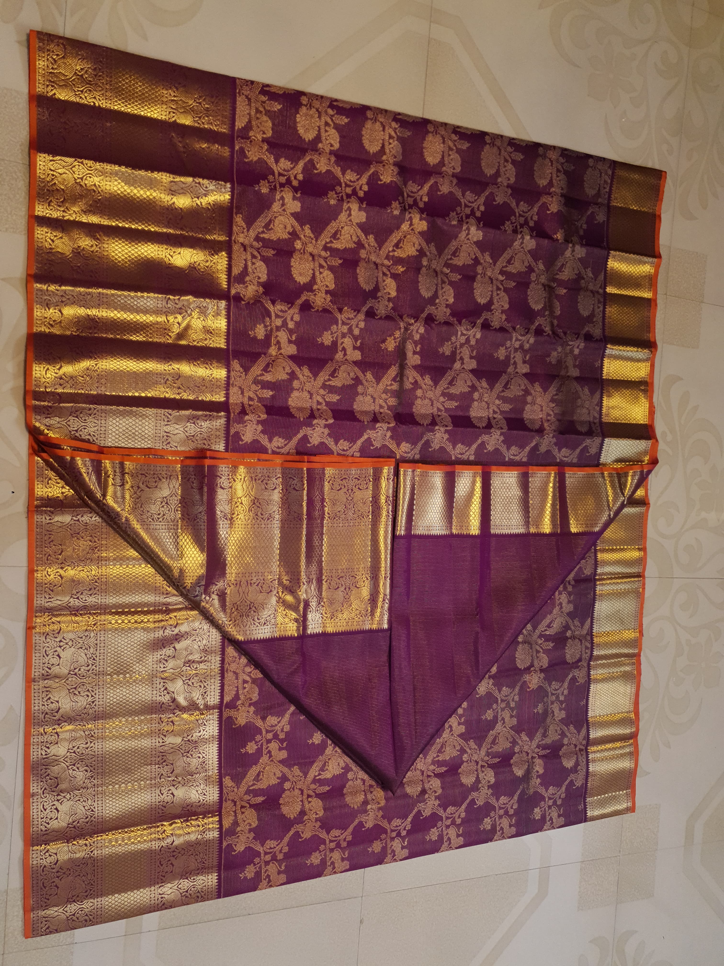 Magenta Kanchipuram handloom silk saree featuring 2G gold vairaoosi stripes, traditional floral motifs, a rich zari border, and Silk Mark certification.