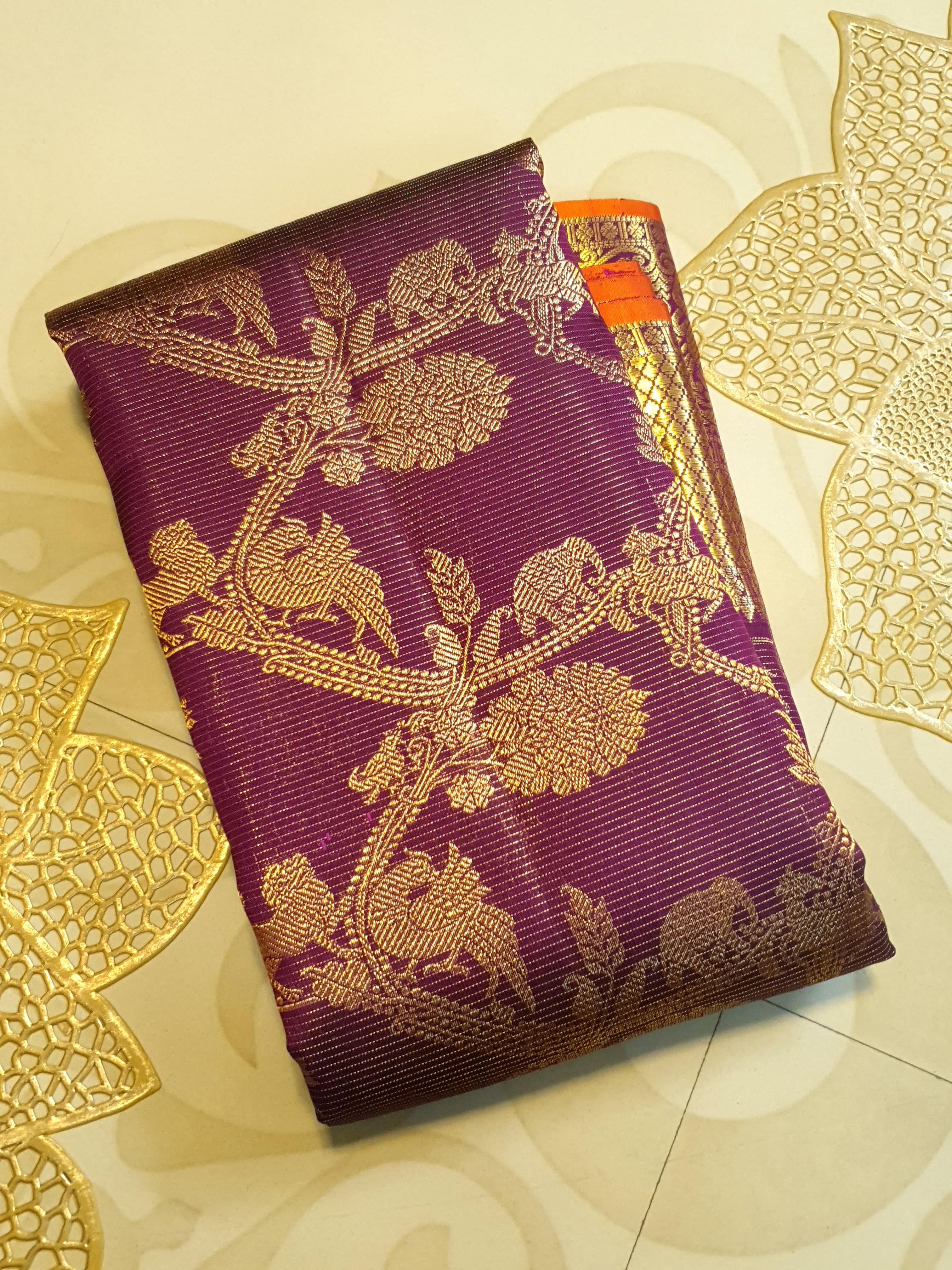 Magenta Kanchipuram handloom silk saree featuring 2G gold vairaoosi stripes, traditional floral motifs, a rich zari border, and Silk Mark certification.