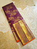 Magenta Kanchipuram handloom silk saree featuring 2G gold vairaoosi stripes, traditional floral motifs, a rich zari border, and Silk Mark certification.