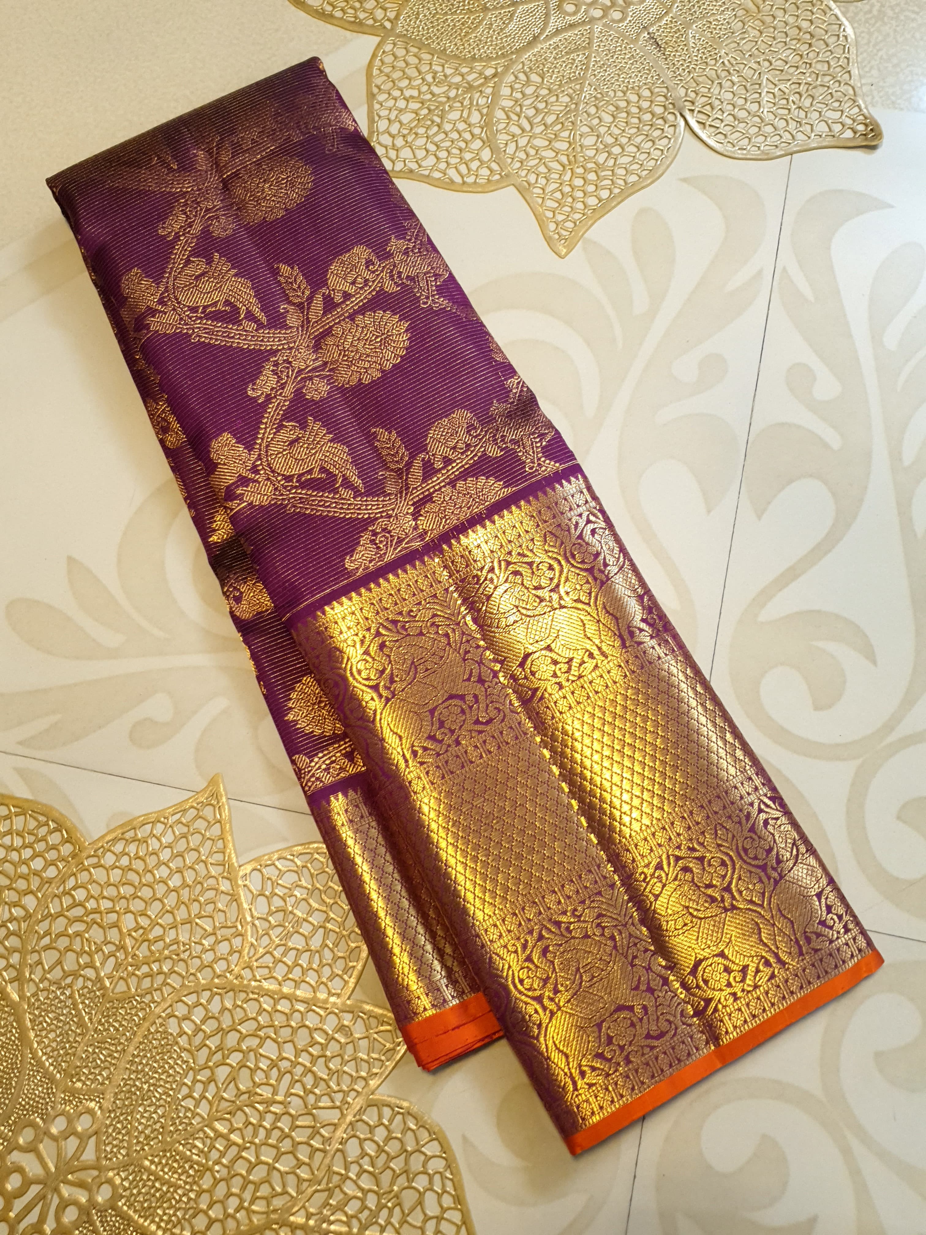 Magenta Kanchipuram handloom silk saree featuring 2G gold vairaoosi stripes, traditional floral motifs, a rich zari border, and Silk Mark certification.