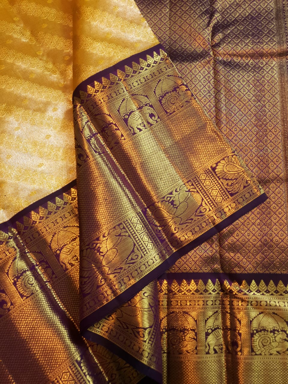 Luxurious Gold Kanchipuram Handloom 2G Gold Tissue Silk Saree with a rich purple and zari woven border and pallu