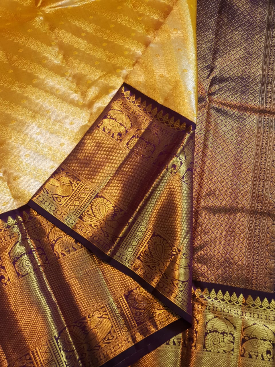 Luxurious Gold Kanchipuram Handloom 2G Gold Tissue Silk Saree with a rich purple and zari woven border and pallu