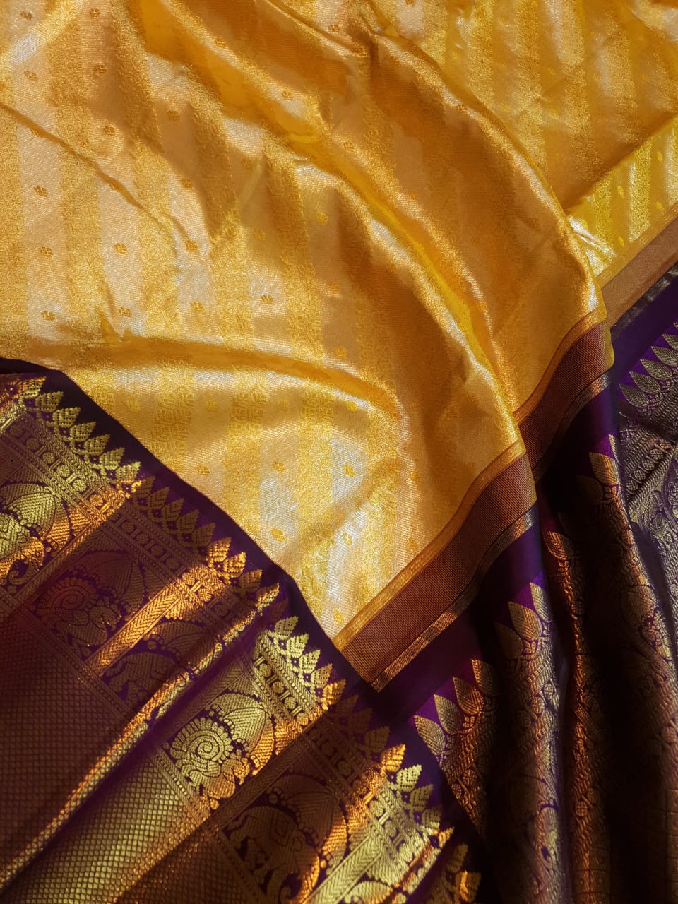 Luxurious Gold Kanchipuram Handloom 2G Gold Tissue Silk Saree with a rich purple and zari woven border and pallu