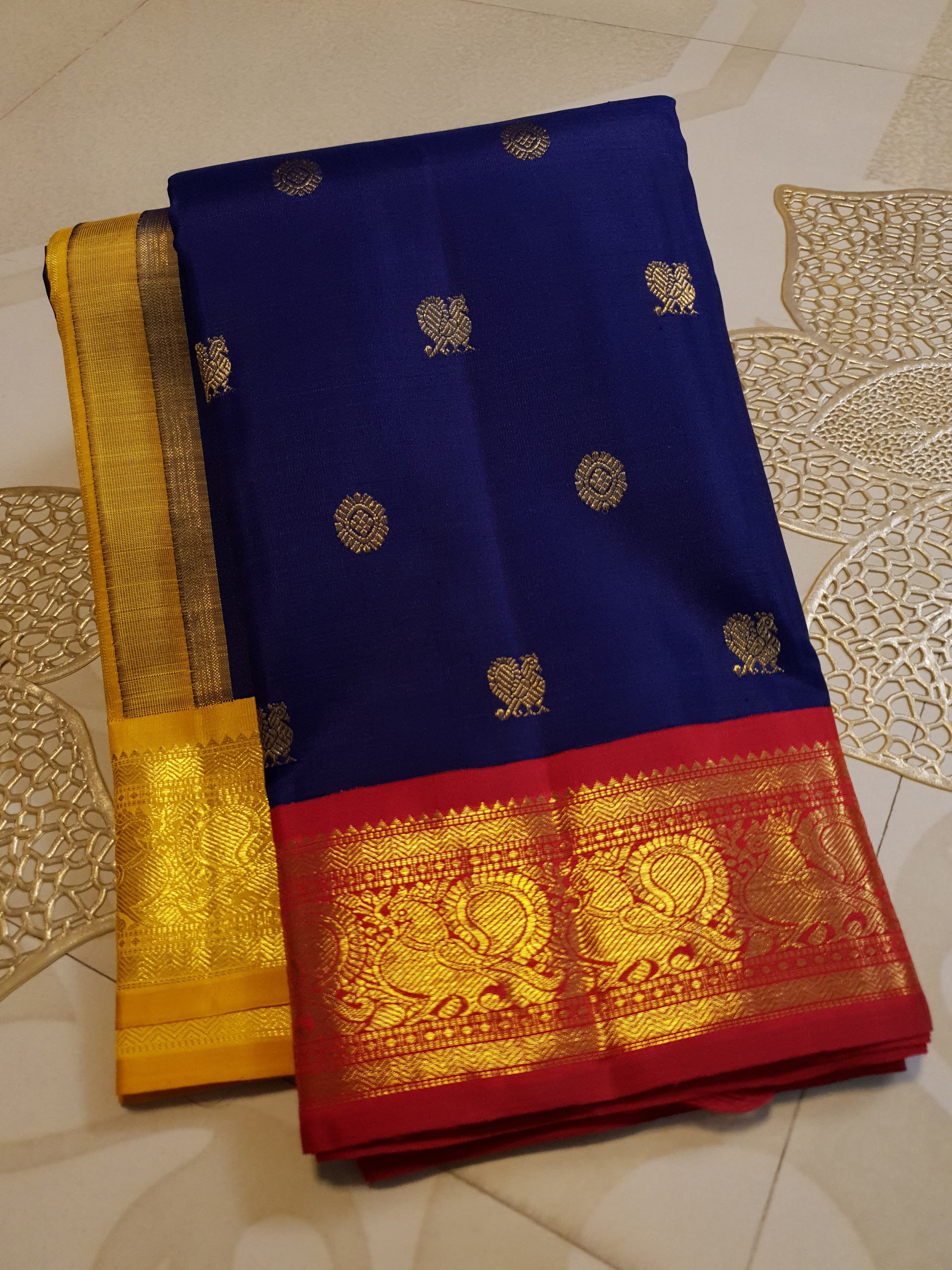 Royal Blue Kanchipuram Handloom 3G Gold Korvai Silk Ganga Jamuna Saree with traditional buttas and dual-color borders.