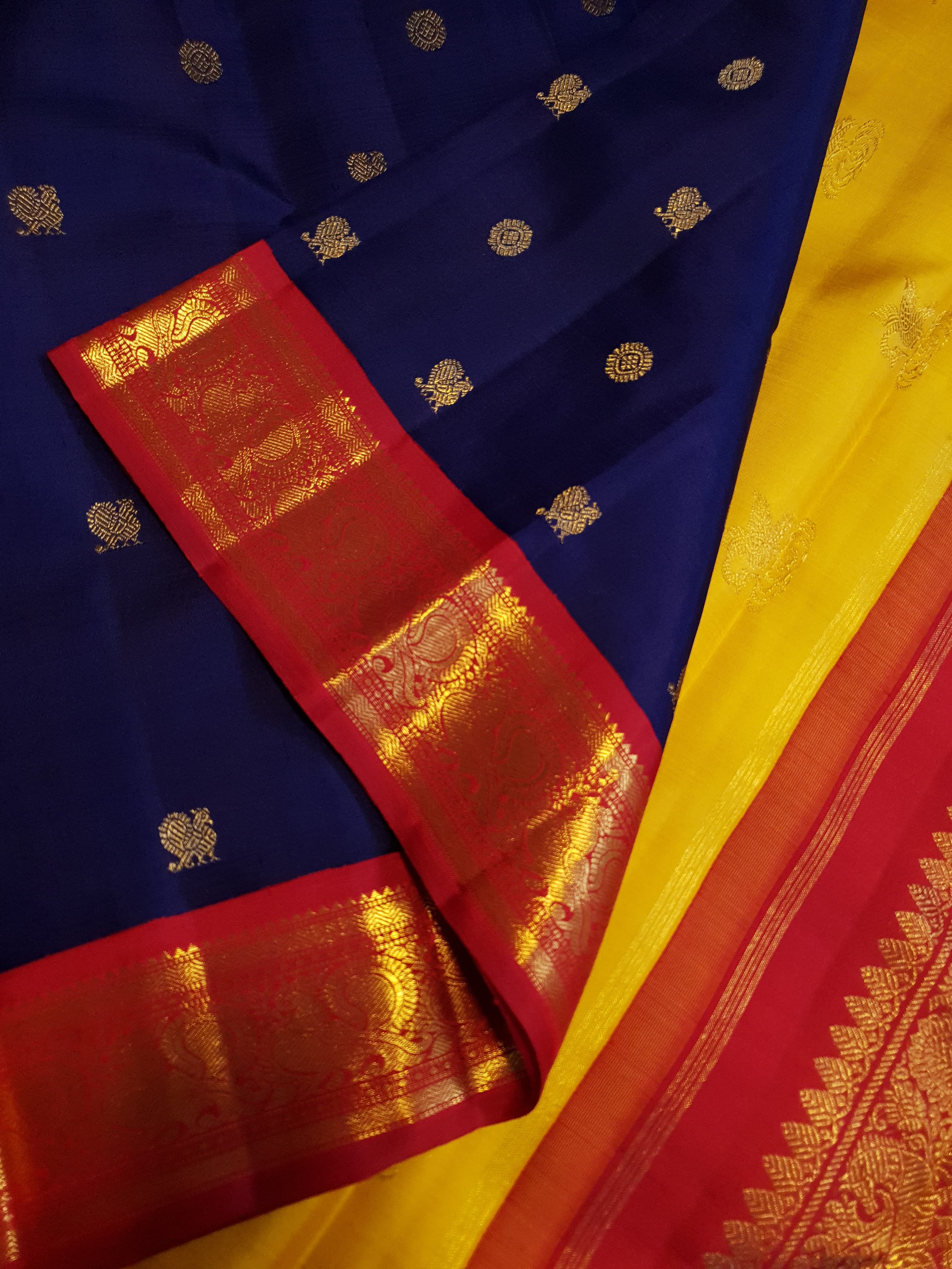 Royal Blue Kanchipuram Handloom 3G Gold Korvai Silk Ganga Jamuna Saree with traditional buttas and dual-color borders.