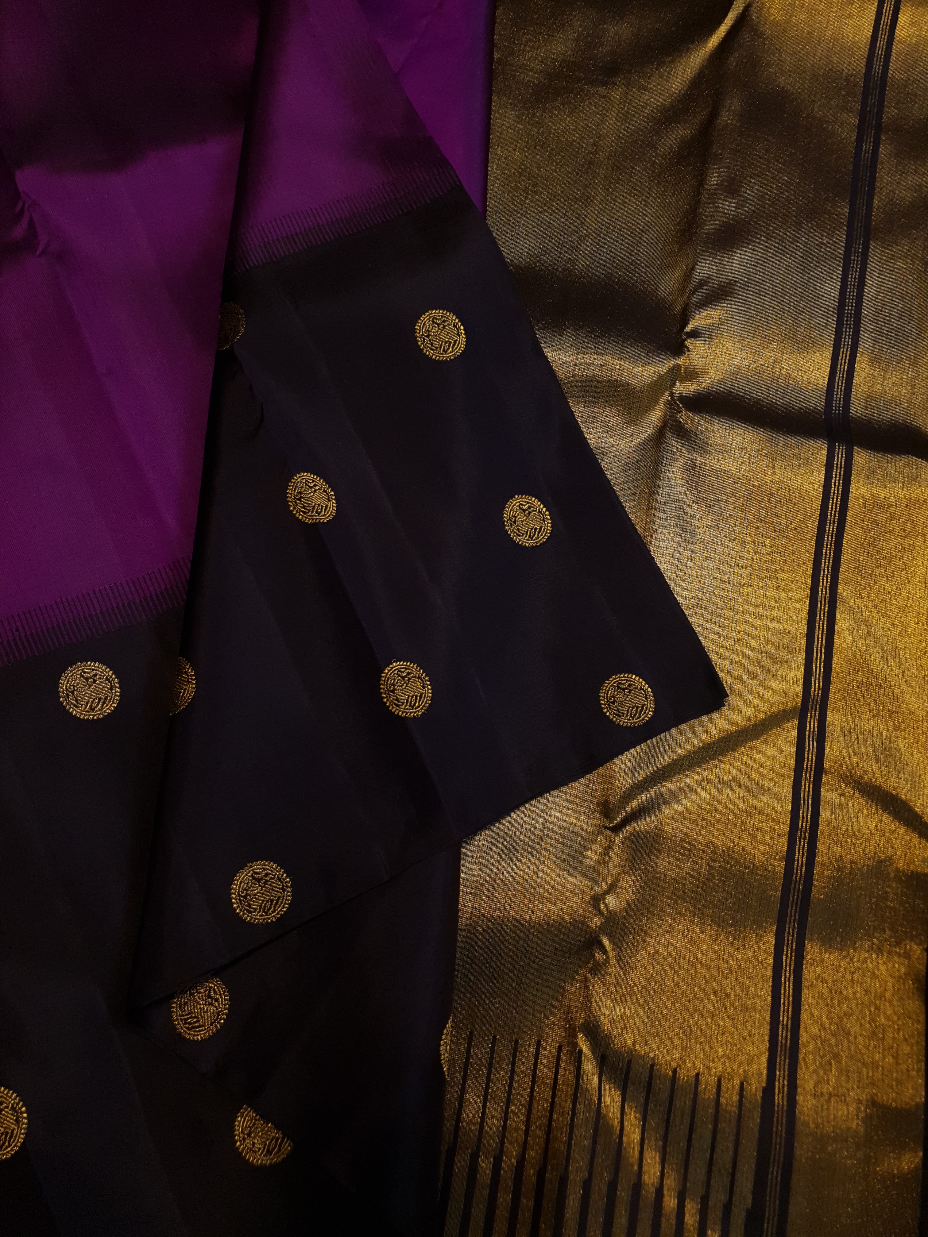 Purple Kanchipuram handloom pure silk saree featuring 2G gold yazhi motifs and rich contrasting details.