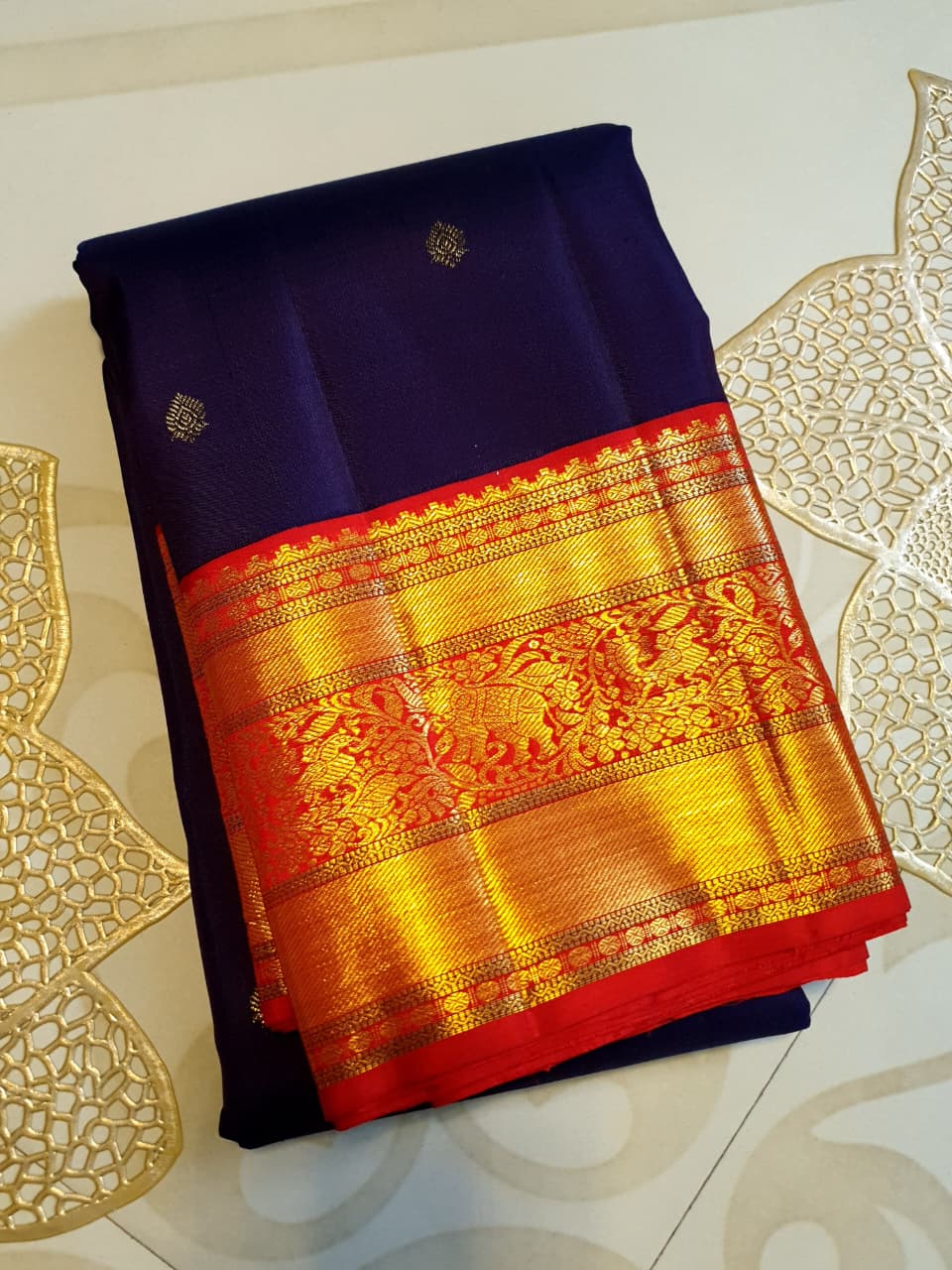 Deep Purple Kanchipuram Handloom Silk Saree with multicolored chakram motifs across the body and a wide red Korvai border featuring intricate gold zari.