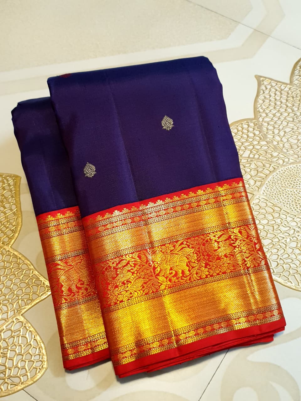 Deep Purple Kanchipuram Handloom Silk Saree with multicolored chakram motifs across the body and a wide red Korvai border featuring intricate gold zari.