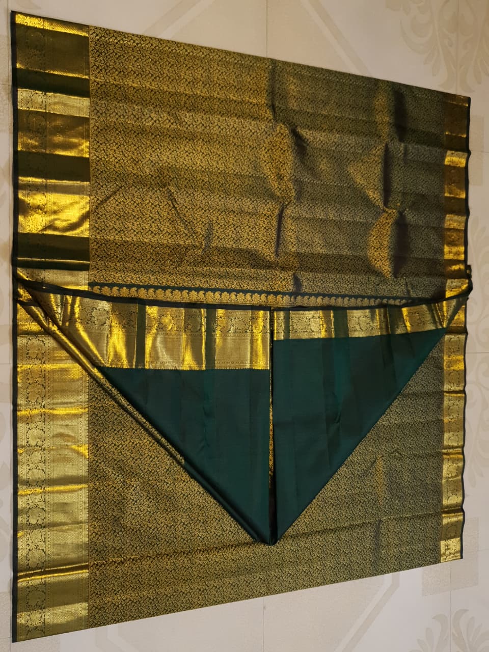 Bottle green Kanchipuram handloom 2G gold bridal silk saree featuring traditional rich zari borders and an all-over intricate brocade weave.