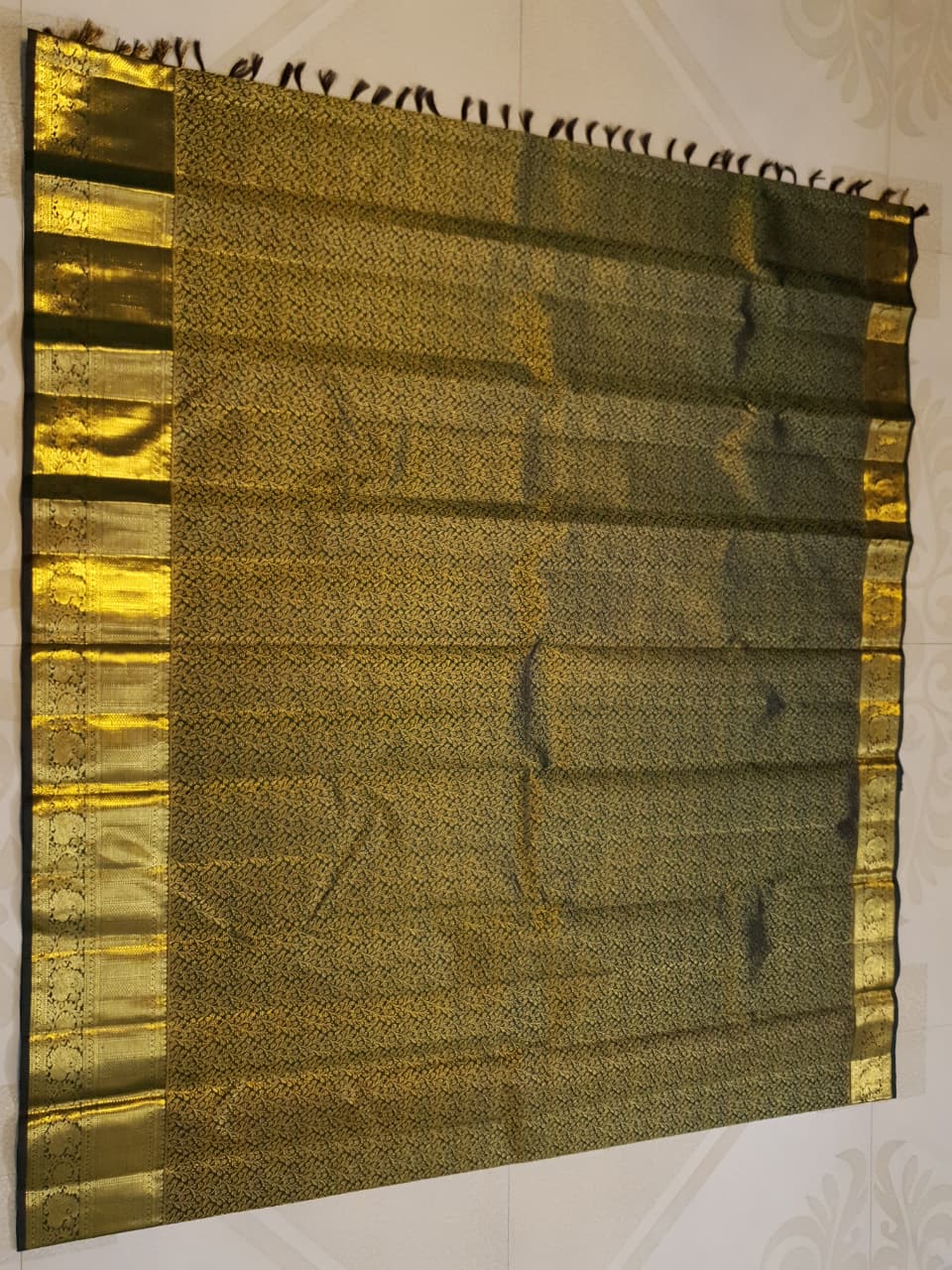 Bottle green Kanchipuram handloom 2G gold bridal silk saree featuring traditional rich zari borders and an all-over intricate brocade weave.