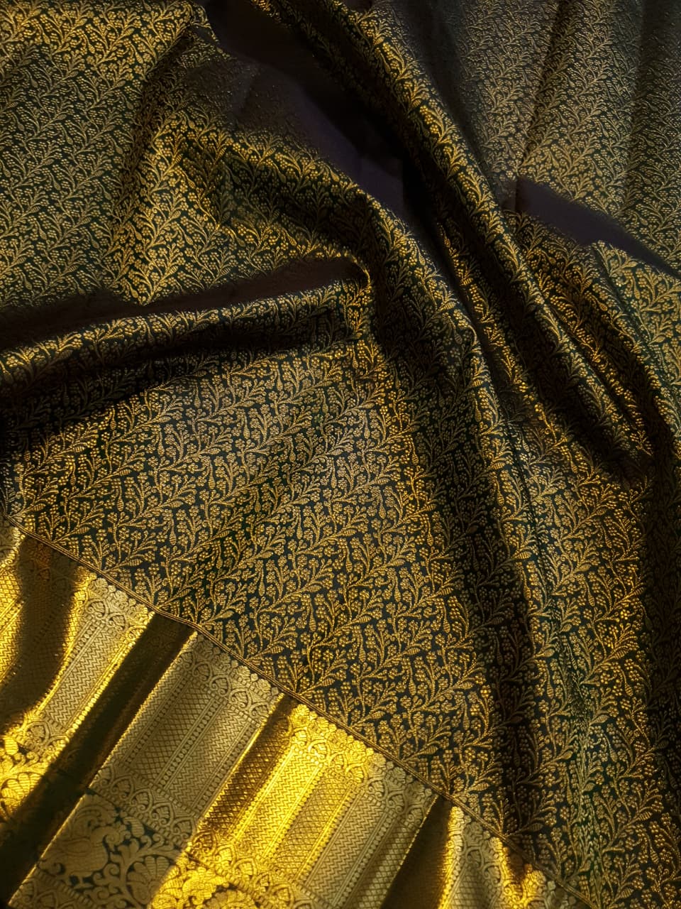 Bottle green Kanchipuram handloom 2G gold bridal silk saree featuring traditional rich zari borders and an all-over intricate brocade weave.