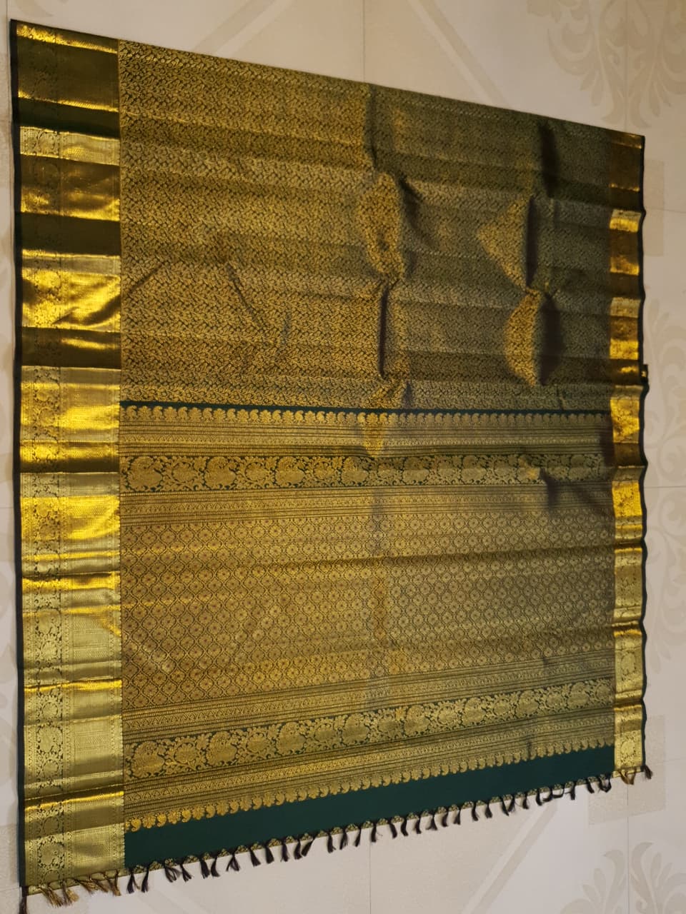 Bottle green Kanchipuram handloom 2G gold bridal silk saree featuring traditional rich zari borders and an all-over intricate brocade weave.