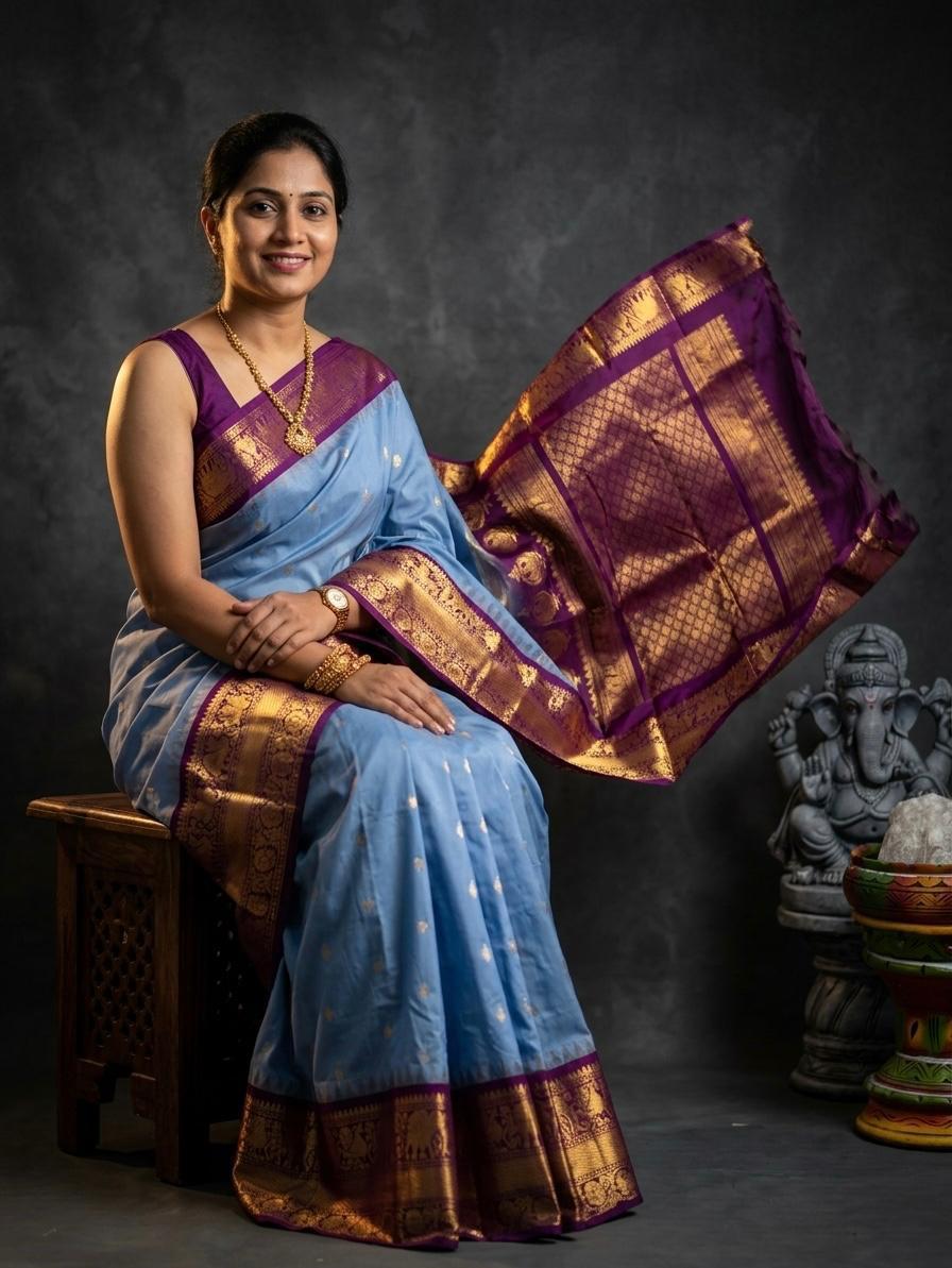 A luxurious Kanchipuram semi pattu silk bridal saree showcasing a rich textured body and a wide, bold contrast zari border with traditional temple motifs.