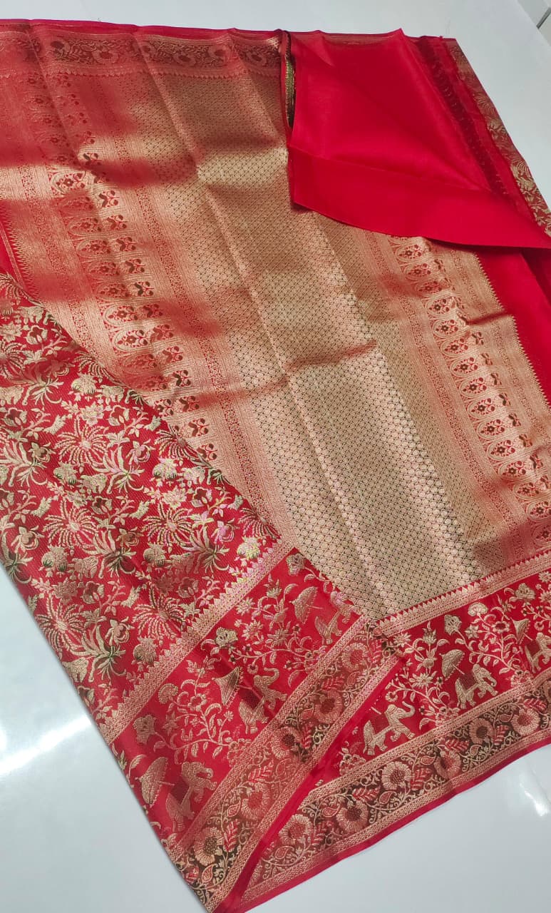 Vibrant red Kanchipuram handloom silk saree featuring detailed 1G gold brocade and multicolored Resham Meenakari work including elephant and floral vine patterns.
