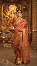 Red Kanchipuram handloom 2G gold pattu silk saree featuring intricate gold brocade weaving and a detailed Lord Murugan pallu.