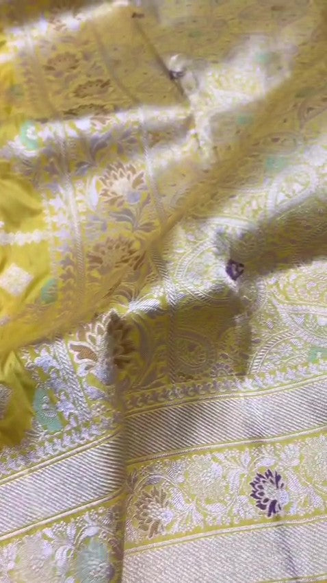 Lime Yellow Banarasi Handloom Katan Silk Saree with a detailed checkered body and purple Meenakari floral motifs