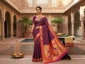 Magenta Paithani Handloom Pure Silk Saree with subtle self check pattern on the body and a tissue zari Munia (Parrot) pallu featuring colourful birds perched on flowering branches.
