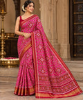 Dark pink Patan Patola pure mulberry silk saree featuring an intricate geometric double ikat lattice design with a matching patterned pallu and traditional borders.
