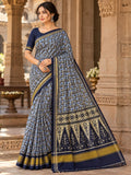 Black and blue Patan Patola pure mulberry silk saree featuring a geometric labyrinth pattern with a traditional black and cream patterned pallu.