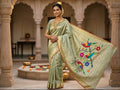 Pista Green Paithani Handloom Pure Silk Saree featuring subtle self-woven buttas on the body and a tissue zari pallu adorned with colorful parrots perched on flowering branches.