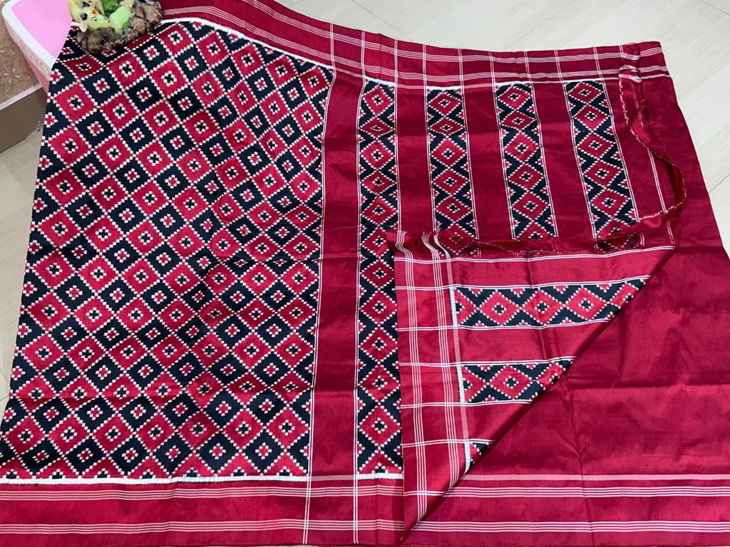 Red Pochampally Handloom Double Ikat Patola Silk Saree, showcasing its rich geometric pattern and premium texture.