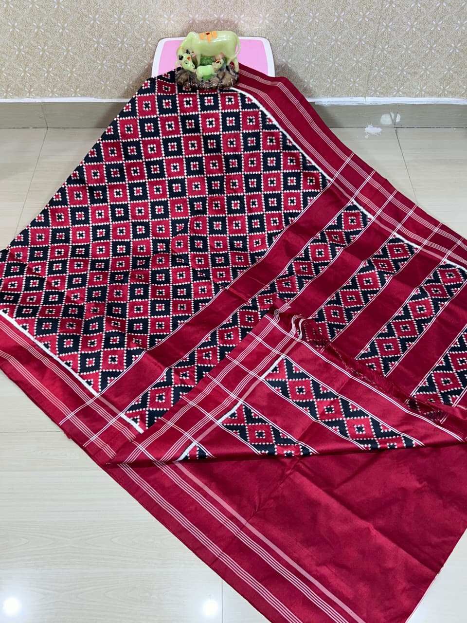 Red Pochampally Handloom Double Ikat Patola Silk Saree, showcasing its rich geometric pattern and premium texture.