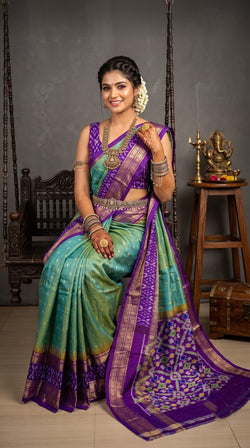 Pochampally Handloom Ikat Madthasu Patola Silk Saree in rich weave with intricate all-over zari buttas