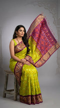 Pochampally Handloom Ikkat Sico Silk Saree with an intricate geometric pattern, a thick golden zari border, and pallu featuring traditional floral motifs.