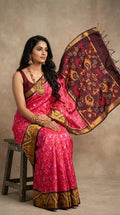 Pochampally Handloom Ikkat Sico Silk Saree with an intricate geometric pattern, a thick golden zari border, and a black pallu featuring traditional floral motifs.