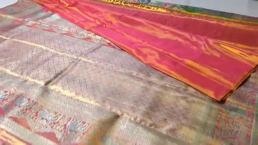 Turquoise Kanchipuram handloom tissue brocade Meenakari silk saree with intricate floral motifs and a pink contrast border.