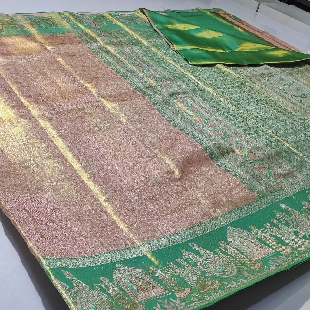 Baby Pink Kanchipuram handloom silk saree featuring intricate gold tissue brocade and a traditional Kalyana Pallakku motif border.