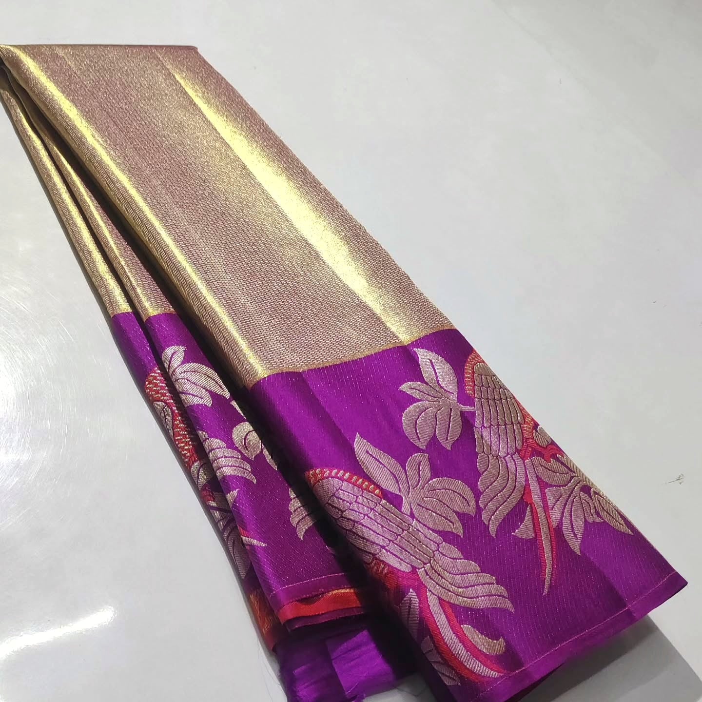 Gold Kanchipuram Handloom 1G Tissue Brocade Meenakari Silk Saree featuring a shimmering tissue weave, rich Meenakari details, and Silk Mark certification.