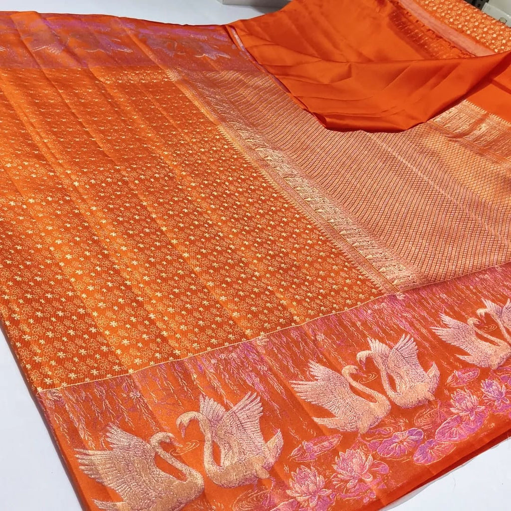 Orange Kanchipuram silk saree with intricate swan and floral zari border