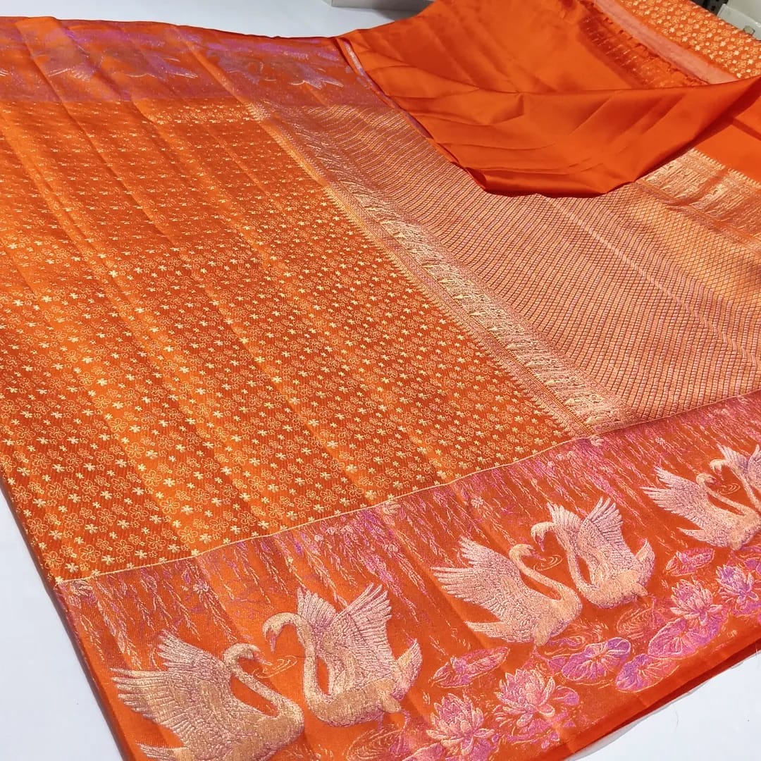 Orange Kanchipuram silk saree with intricate swan and floral zari border