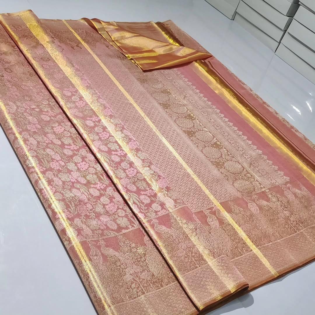 Dual-tone peach Kanchipuram handloom tissue brocade silk saree with intricate gold zari detailing, perfect for elegant wedding and festive looks.