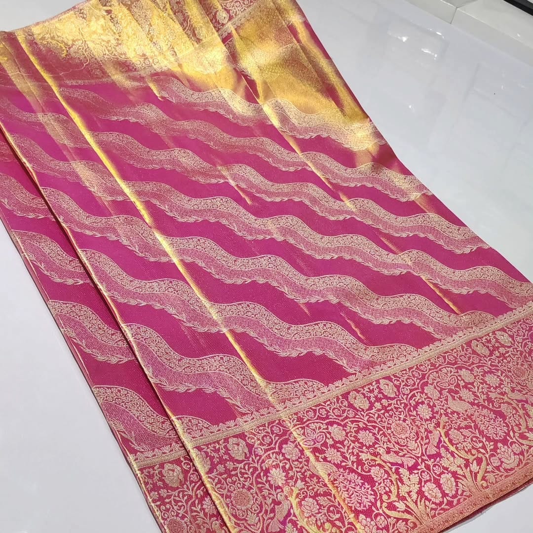 Shop our authentic Hot Pink Kanchipuram Handloom Tissue Brocade Silk Saree. Featuring intricate Meenakari work and Silk Mark certification for guaranteed purity.