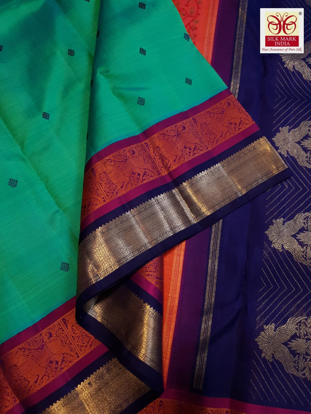 A radiant rexona green Kanchipuram handloom 3G gold vintage korvai silk saree showcasing two-tone contrast borders and intricate motifs.