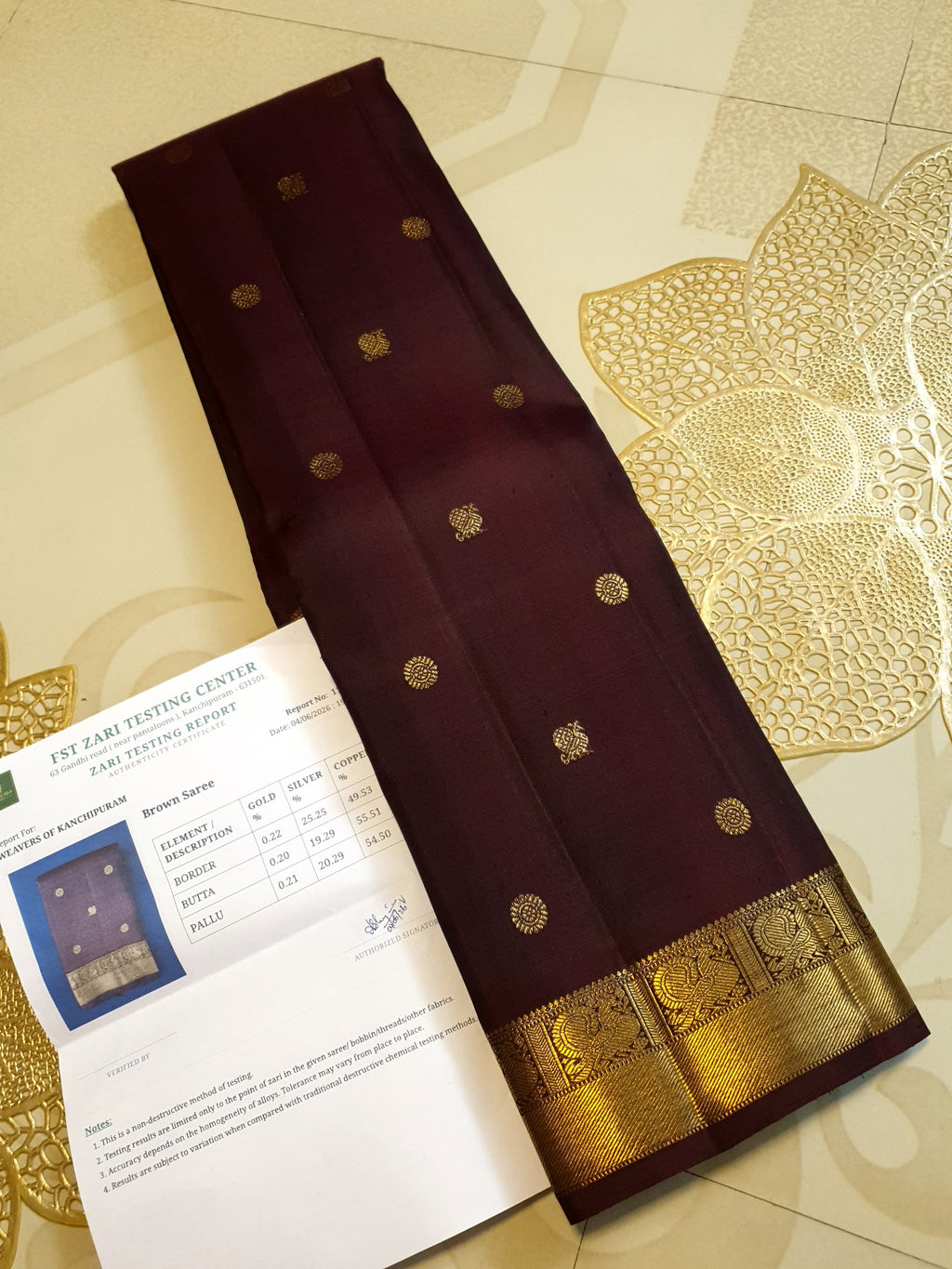A deep purple Kanchipuram handloom 3G gold pattu silk saree adorned with intricate gold buttas and a rich traditional pallu.