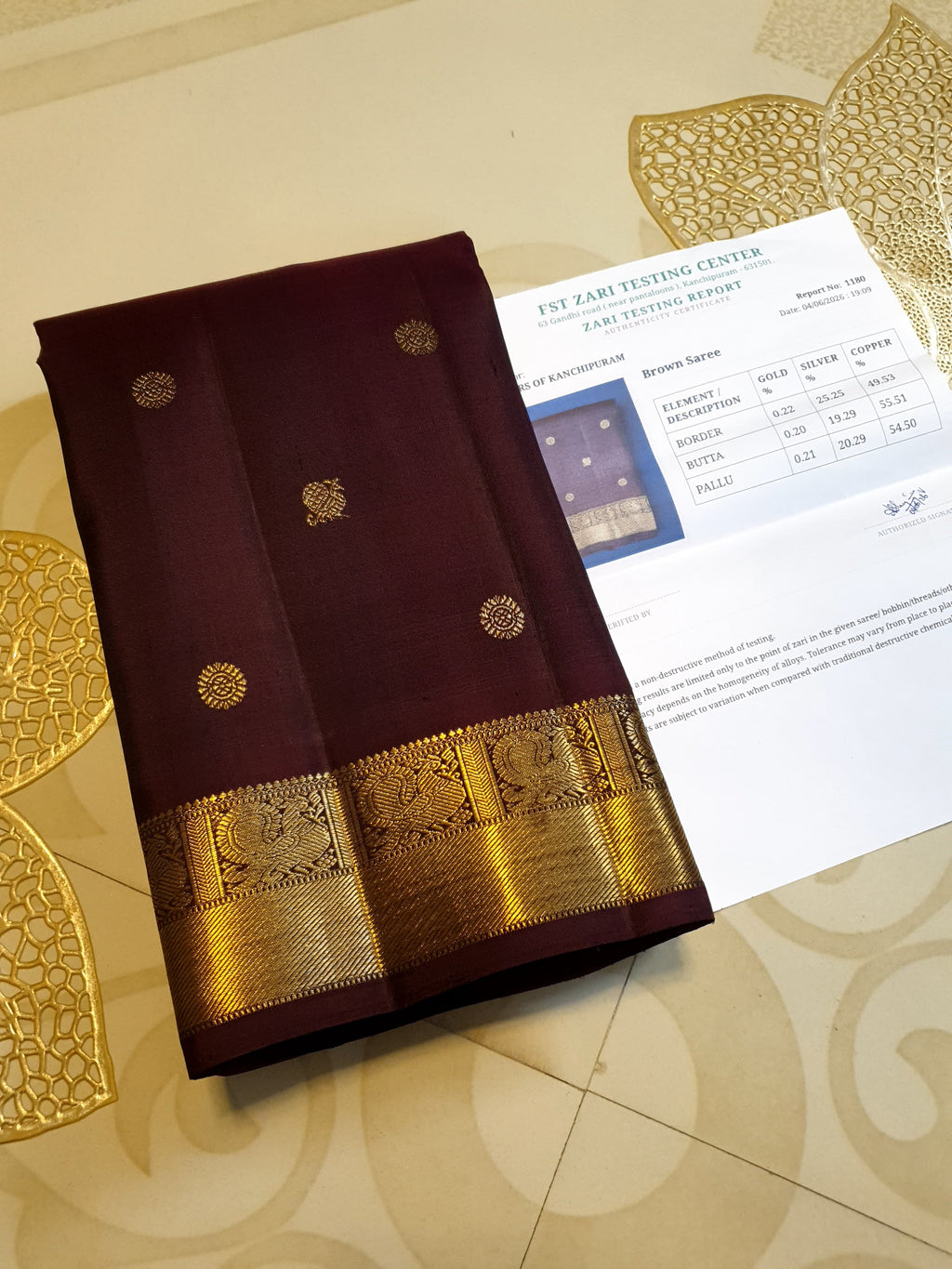 A deep purple Kanchipuram handloom 3G gold pattu silk saree adorned with intricate gold buttas and a rich traditional pallu.