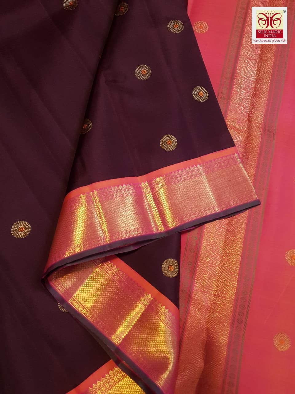 A rich brown Kanchipuram handloom 3G gold vintage korvai silk saree showcasing traditional contrasting borders and intricate motifs.