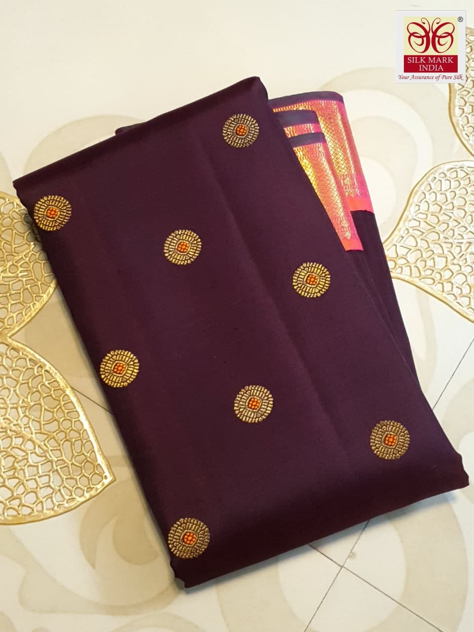 A rich brown Kanchipuram handloom 3G gold vintage korvai silk saree showcasing traditional contrasting borders and intricate motifs.