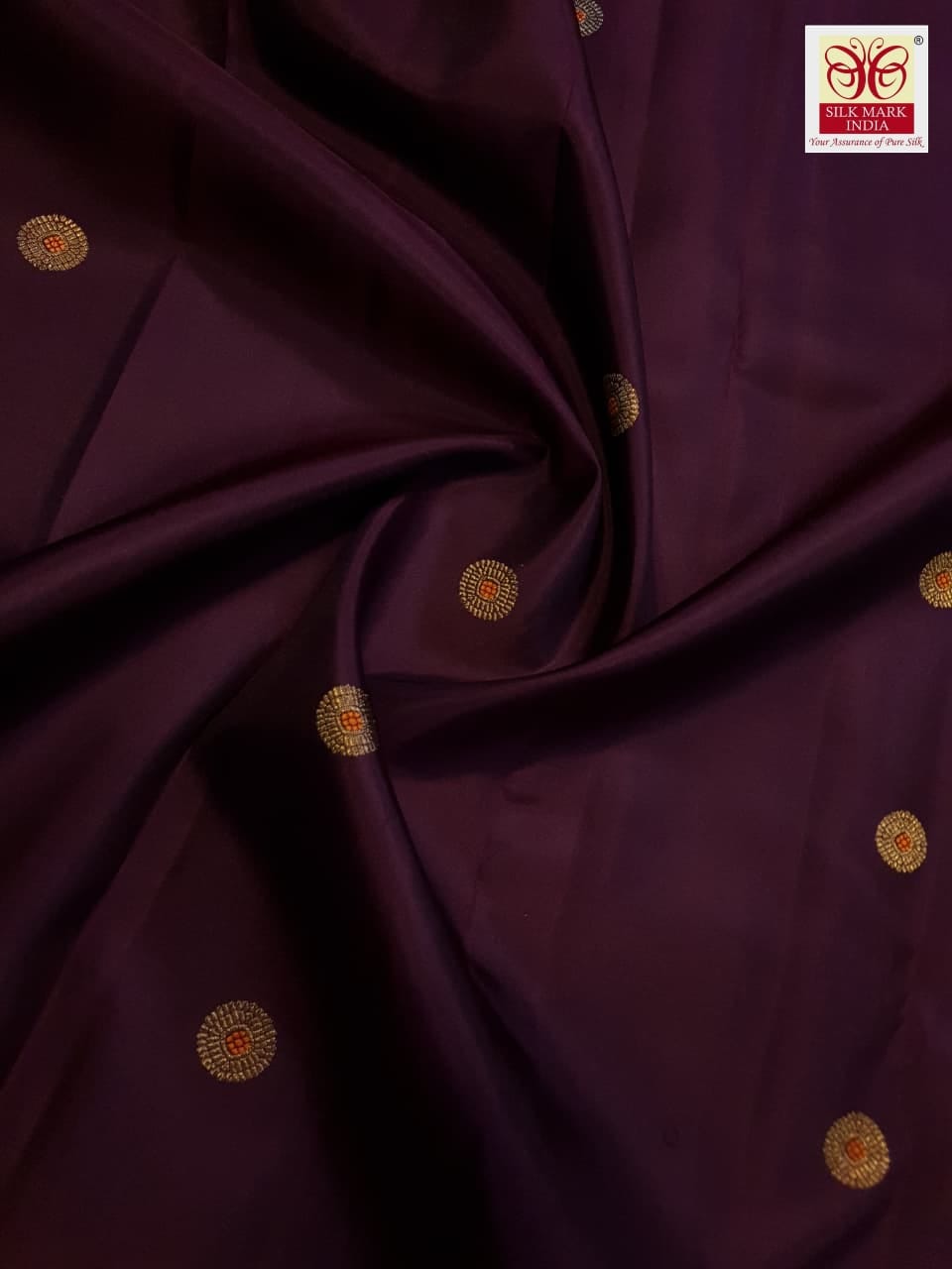 A rich brown Kanchipuram handloom 3G gold vintage korvai silk saree showcasing traditional contrasting borders and intricate motifs.