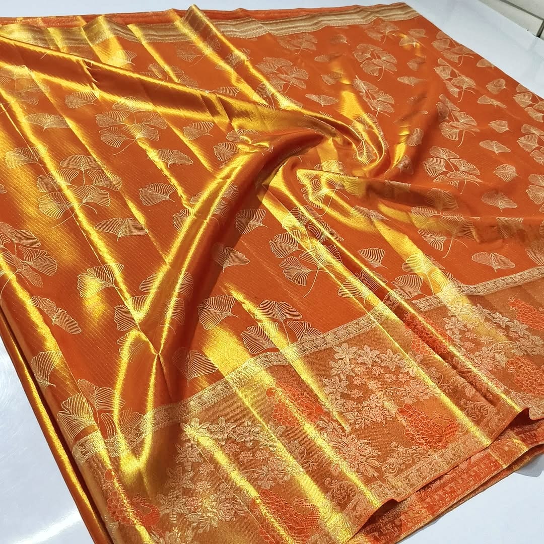 Orange Kanchipuram Handloom Tissue Silk Saree highlighting the intricate gold Meenakari brocade and signature tissue texture.