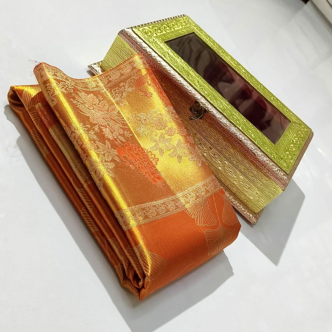 Orange Kanchipuram Handloom Tissue Silk Saree highlighting the intricate gold Meenakari brocade and signature tissue texture.