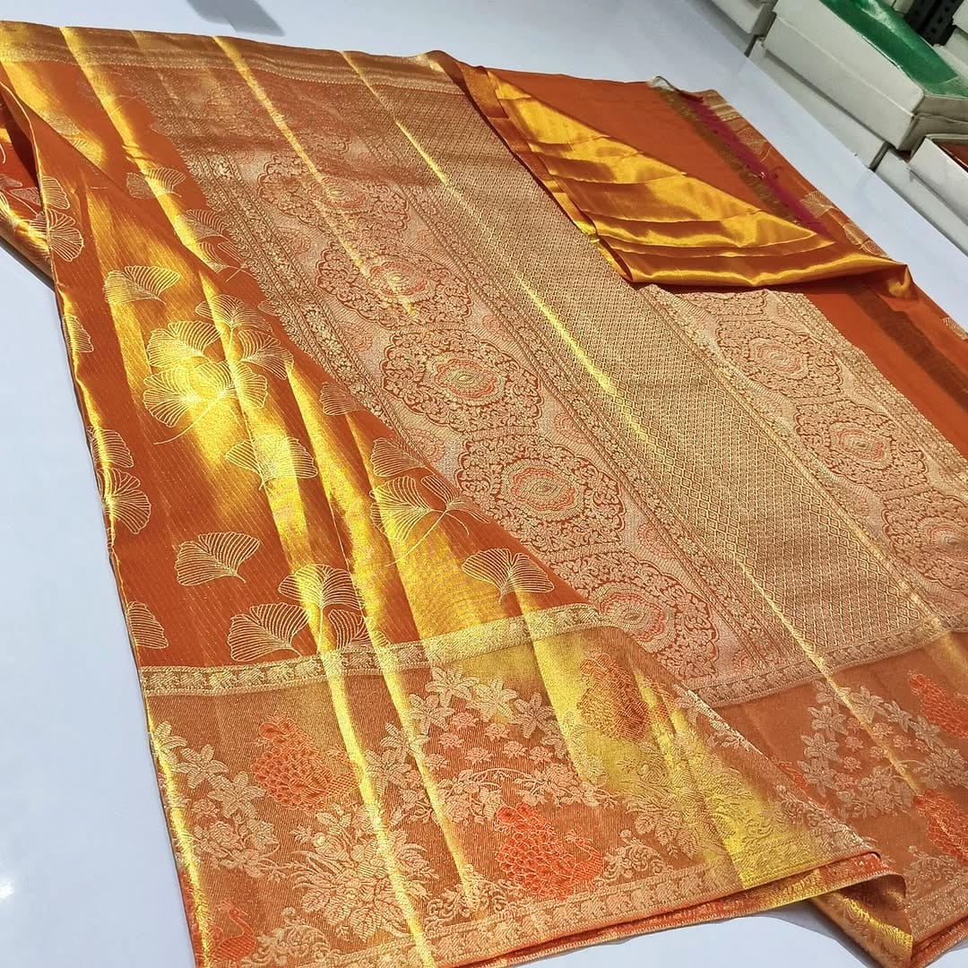 Orange Kanchipuram Handloom Tissue Silk Saree highlighting the intricate gold Meenakari brocade and signature tissue texture.