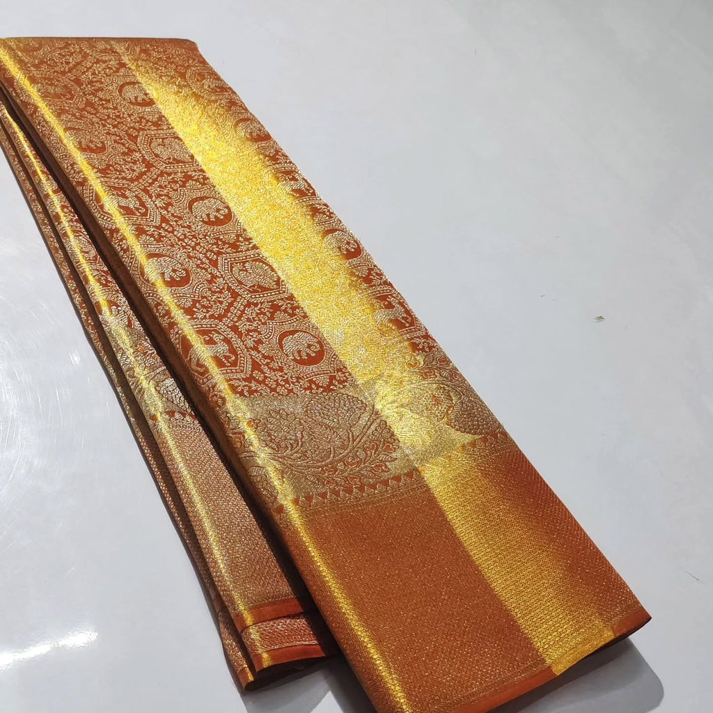 Elegant orange Kanchipuram handloom tissue brocade silk bridal saree with intricate meena detailing