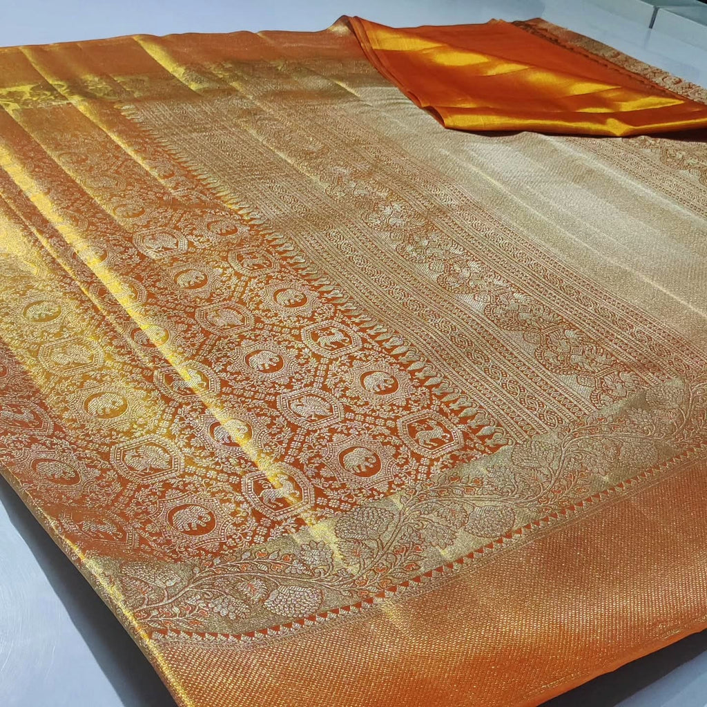 Elegant orange Kanchipuram handloom tissue brocade silk bridal saree with intricate meena detailing